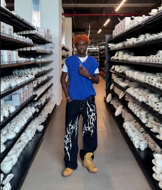 Zaggi Wears knit vest and painted trousers